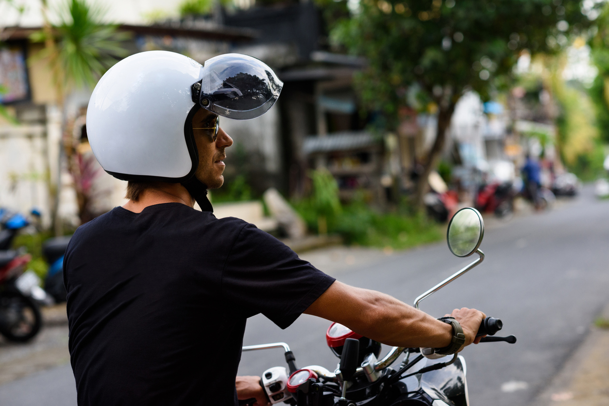 Man riding a motorbike in Asia