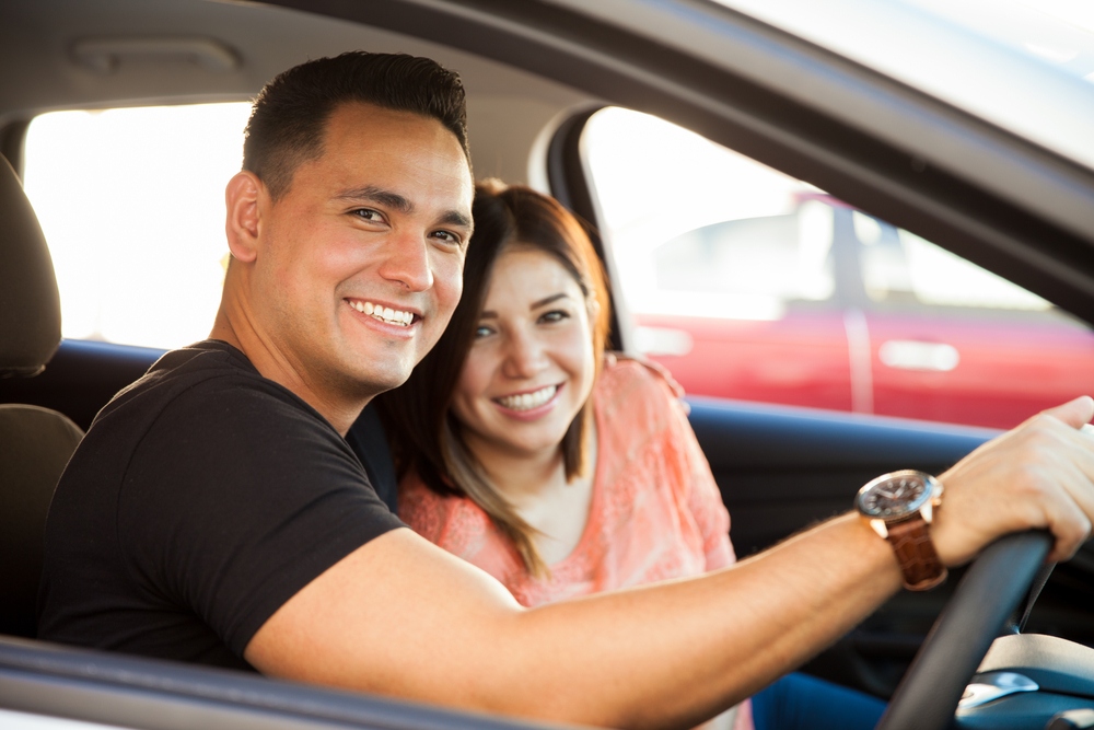 Couple driving in their car