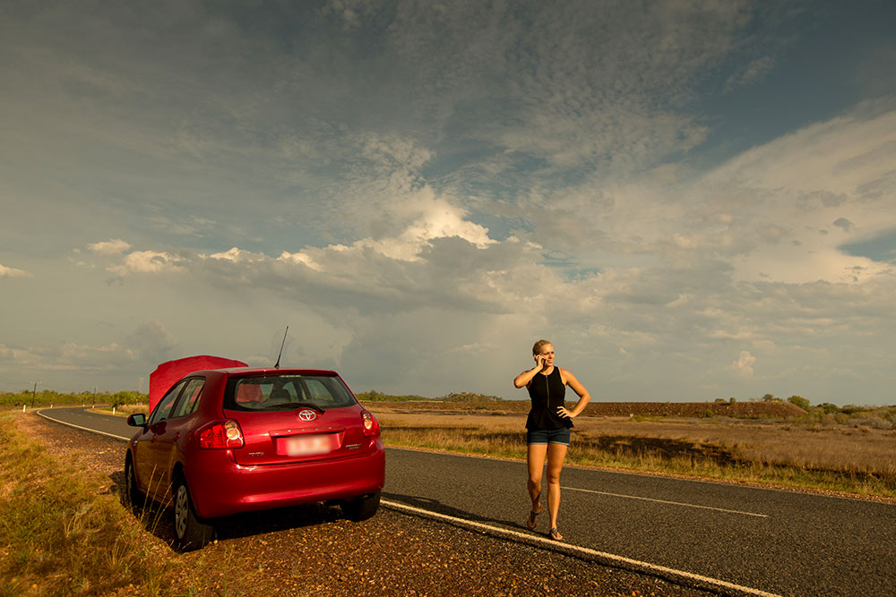 Broken down red car