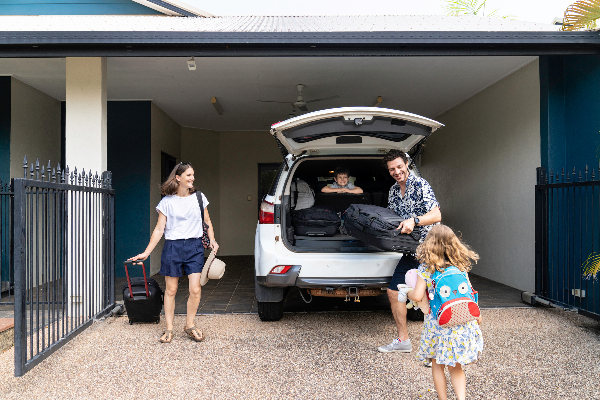 Family packing a car for holidays 