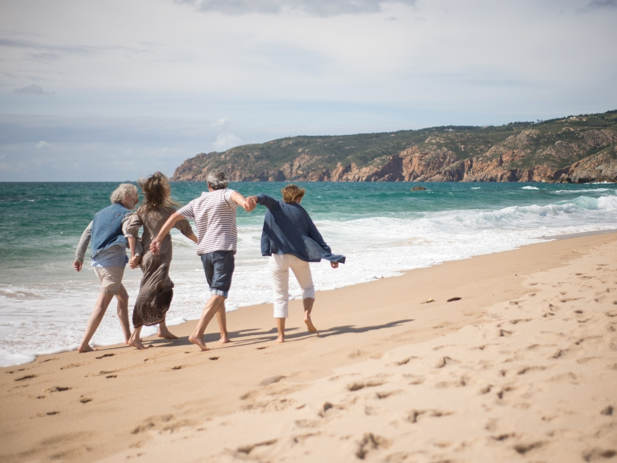 Seniors walking on the beach