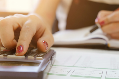 Person doing calculations on a calculator  