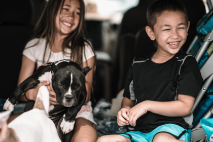 Kids with dog in car