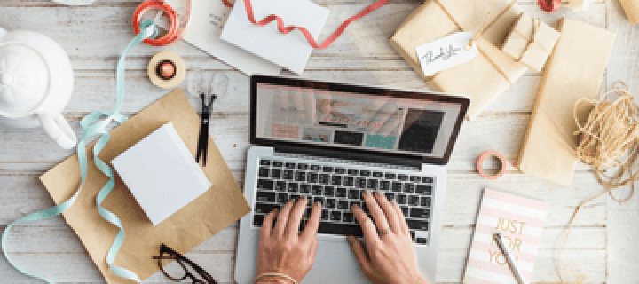 hands typing on a laptop