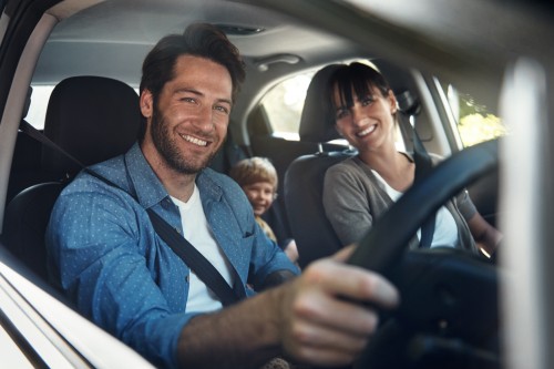 Family of three inside their car