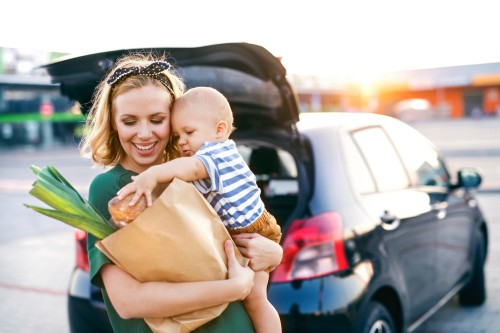 Woman and child with groceries