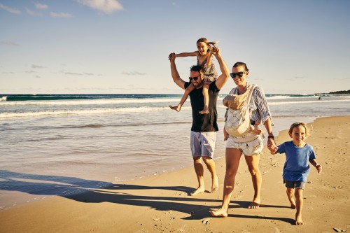 Family walking on the beach 