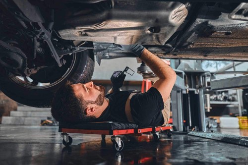 Man servicing a car