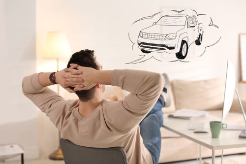 Man dreaming of a new car