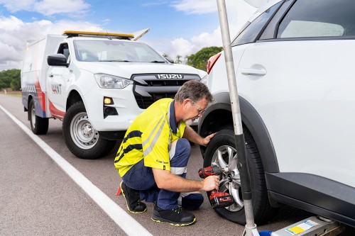 Roadside Assistance team changing a wheel