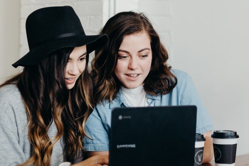 Two women in front of a computer