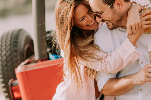 couple happy with car